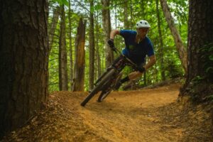 A man mountain biking in Gatlinburg at CLIMB Works.