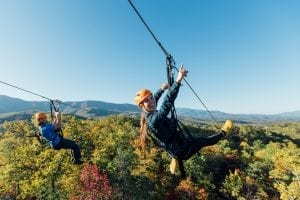 friends on mountaintop zipline tour climb works