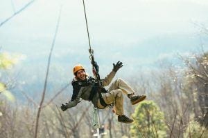 guy ziplining in Smoky Mountains